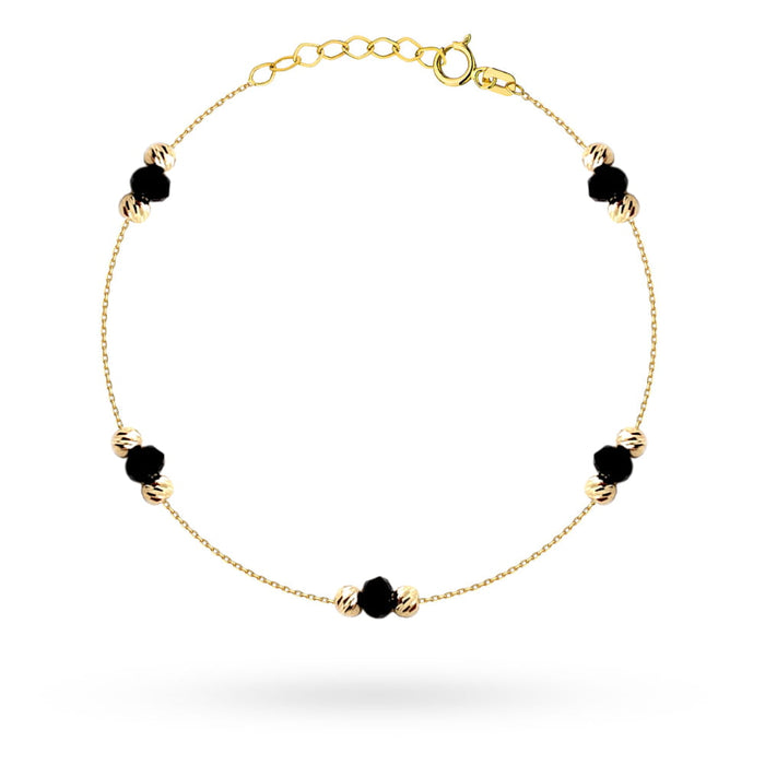 Bratara de aur cu pietre negre si bile de diamant